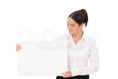 Happy businesswoman looking aside empty banner