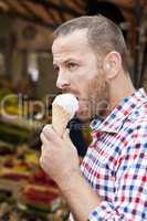 man eats icecream