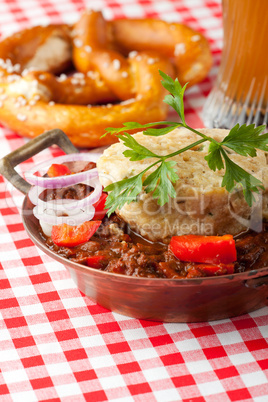 goulash with dumpling on red plaid