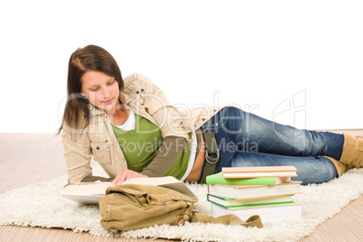 Student female teenager read homework with book