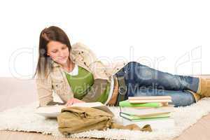 Student female teenager read homework with book