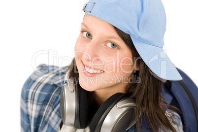 Smiling teenager girl enjoy music with headphones