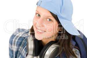 Smiling teenager girl enjoy music with headphones