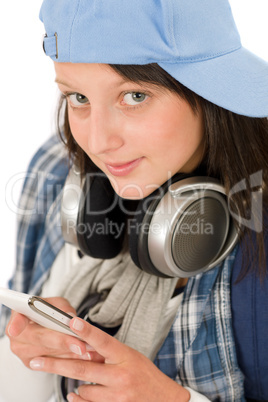 Smiling teenager girl enjoy music with headphones