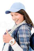 Happy female teenager cool outfit thumb-up