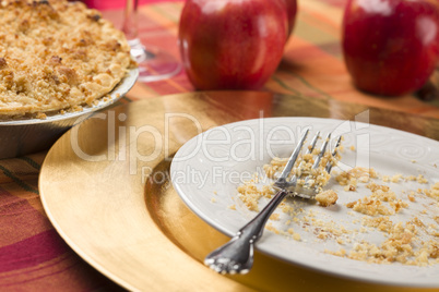 Apple Pie and Empty Plate with Remaining Crumbs