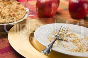 Apple Pie and Empty Plate with Remaining Crumbs