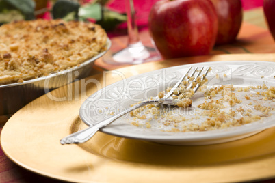 Apple Pie and Empty Plate with Remaining Crumbs