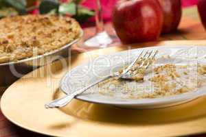 Apple Pie and Empty Plate with Remaining Crumbs