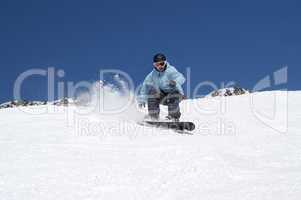 Snowboarding in snowy mountains
