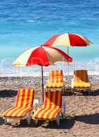 Beach chairs and umbrellas on a sand beach