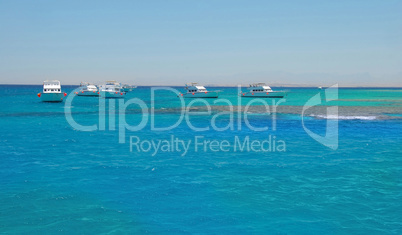 Boats on blue sea water in Egypt