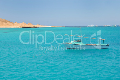 Boat on blue sea water in Egypt