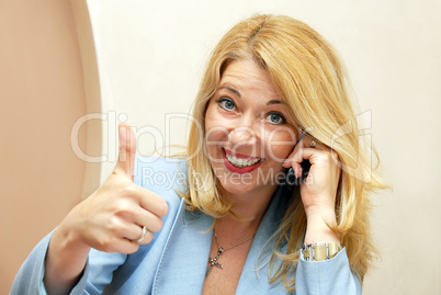 Businesswoman showing ok sign