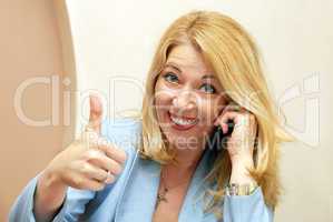 Businesswoman showing ok sign