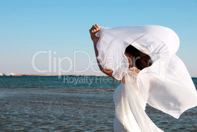 Woman in white at seaside