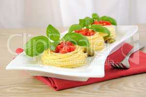 Nest of spaghetti with tomato dressing