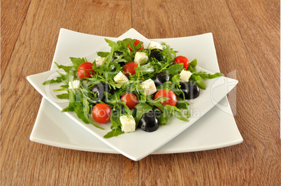 Salad of arugula with cherry tomatoes and grapes