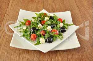 Salad of arugula with cherry tomatoes and grapes