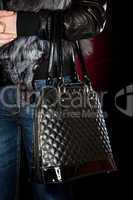 Female hand with a handbag