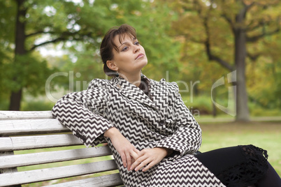 young girl relaxing in autumn park