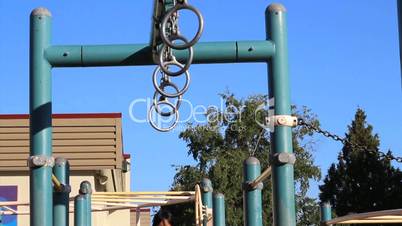 Asian Girl Using Old Style Playground Rings