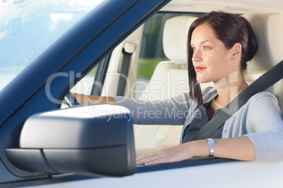 Attractive businesswoman drive luxury car