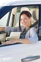 Attractive businesswoman drive luxury car