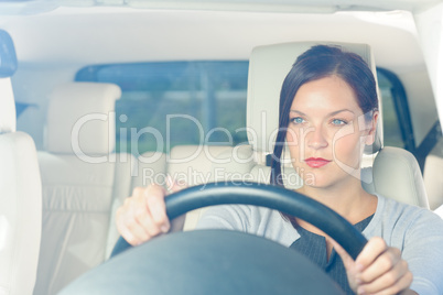 Attractive businesswoman drive luxury car smiling