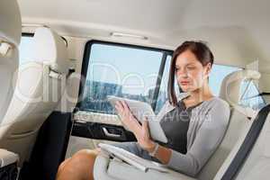 Executive businesswoman in car work touch tablet