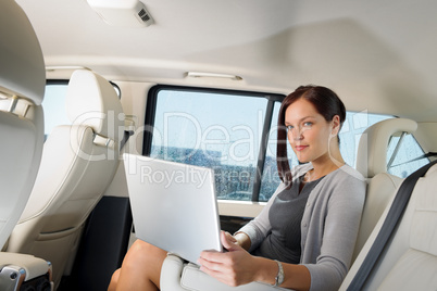 Executive businesswoman work laptop car backseat