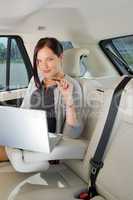 Executive businesswoman work laptop car backseat