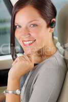 Executive businesswoman luxury car call hands-free