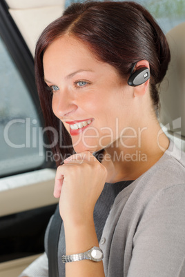 Executive businesswoman luxury car call hands-free