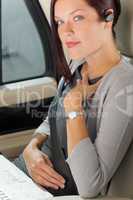 Executive businesswoman luxury car call hands-free