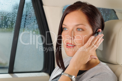 Executive businesswoman luxury car call hands-free