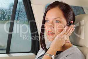 Executive businesswoman luxury car call hands-free