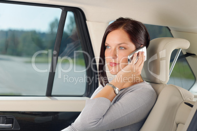 Executive businesswoman sit car backseat calling