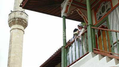 newlyweds on  steps of  mosque after Nikah