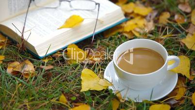 open book and cup of coffee