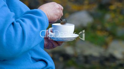 Senior woman with cup of coffee