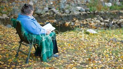 Elderly woman reading  book