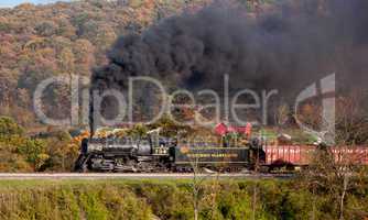 WM Steam train powers along railway