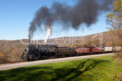 WM Steam train powers along railway