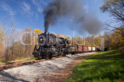 WM Steam train powers along railway