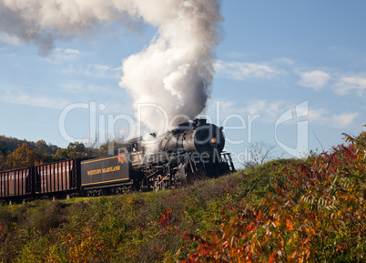 WM Steam train powers along railway