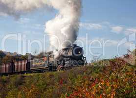 WM Steam train powers along railway