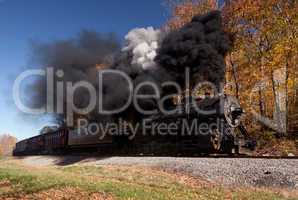 WM Steam train powers along railway