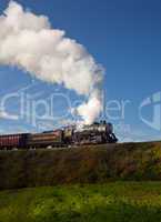 WM Steam train powers along railway