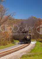 WM Steam train powers along railway